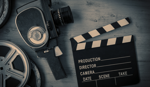 Old camera and clipboard for calling action on a film