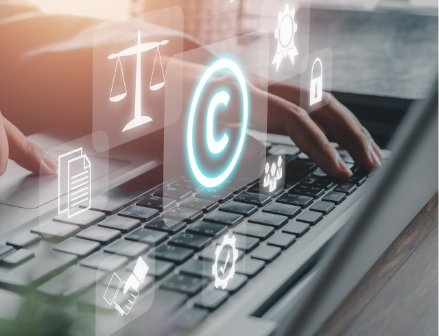 Copyright or patent concept, Person hand using laptop computer on desk with VR screen copyright icon background, Copyleft trademark license, Creation ownership against piracy crime.