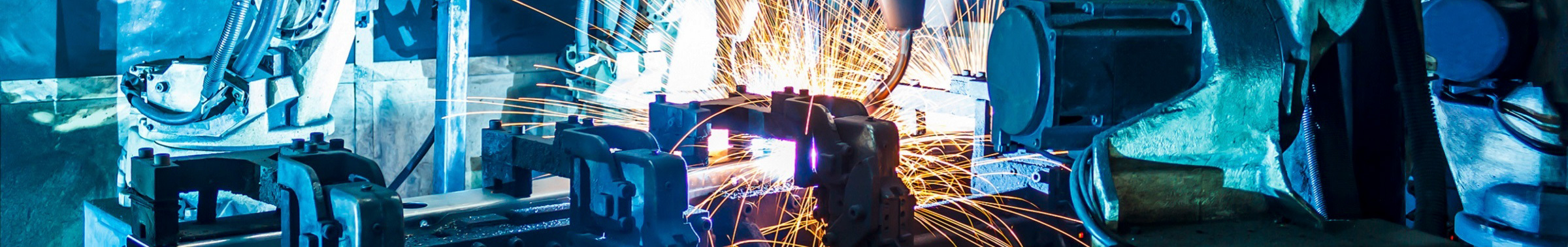 Industrial Worker Using Angle Grinder and Cutting a Metal Tube